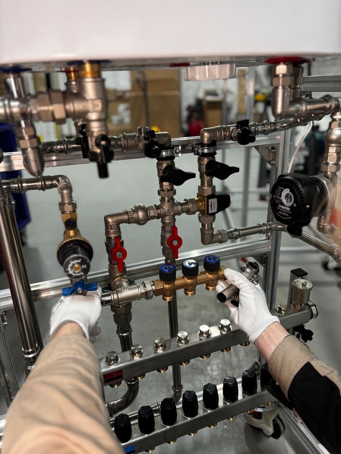 Crafting Captivating Headlines: Your awesome post title goes here Engineer adjusting metal pipeline valves in an industrial setting with precision.